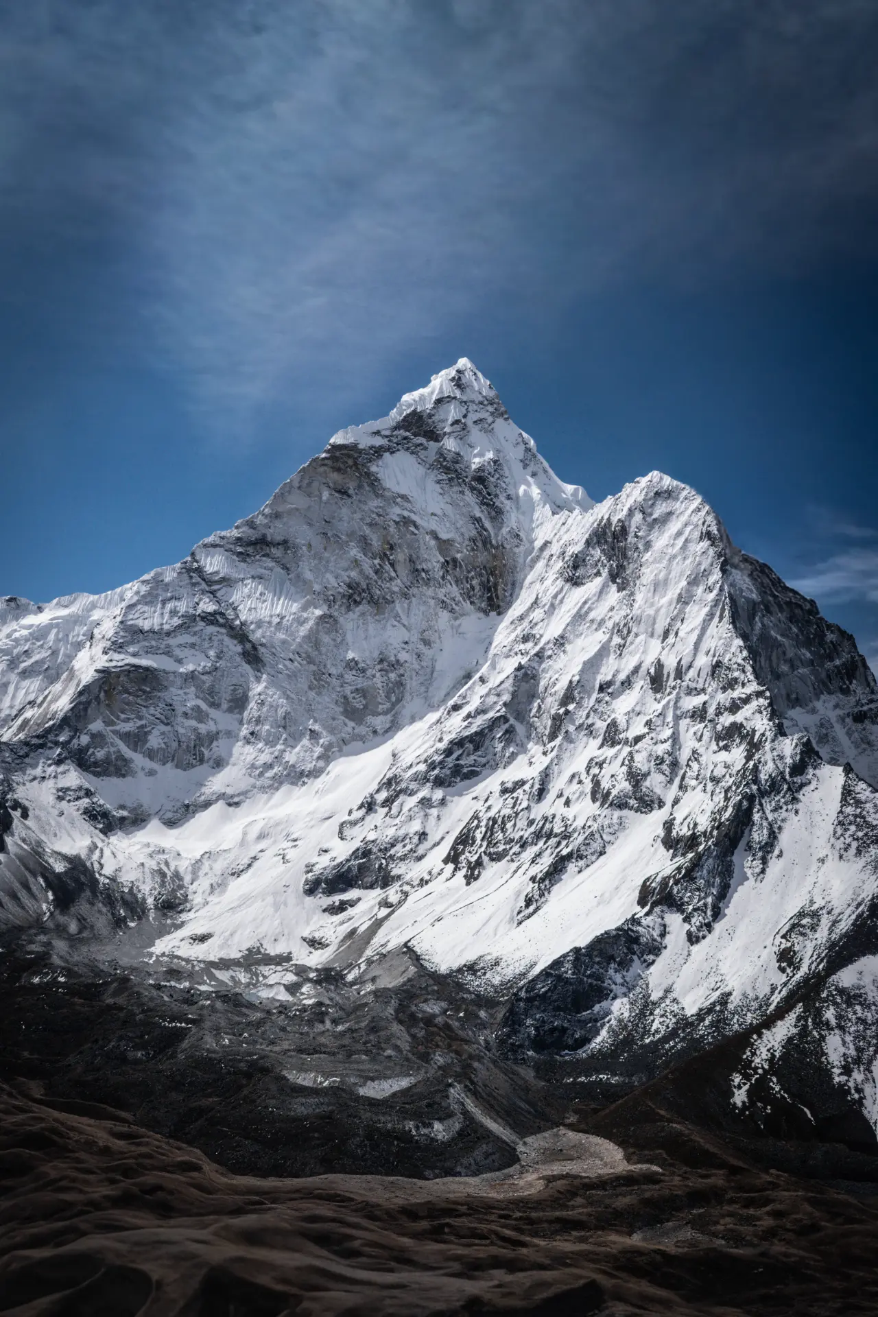 Snow-covered Himalayan peaks beneath a deep blue sky